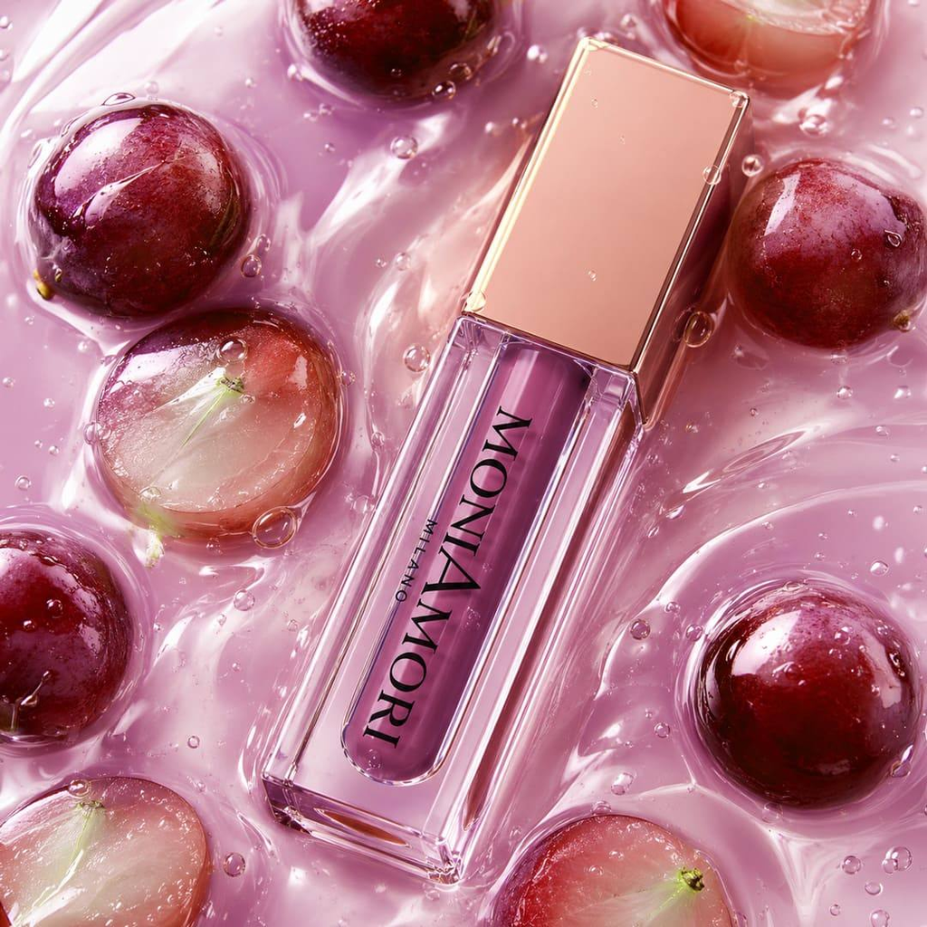 Juicy Oil MoniAmori Milano – visuel lifestyle raisin fond rose