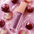 Juicy Oil MoniAmori Milano – visuel lifestyle raisin fond rose